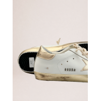 Golden Goose Super Star with gold sparkle foxing and metal stud lettering
