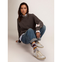 Golden Goose Super Star with gold sparkle foxing and metal stud lettering
